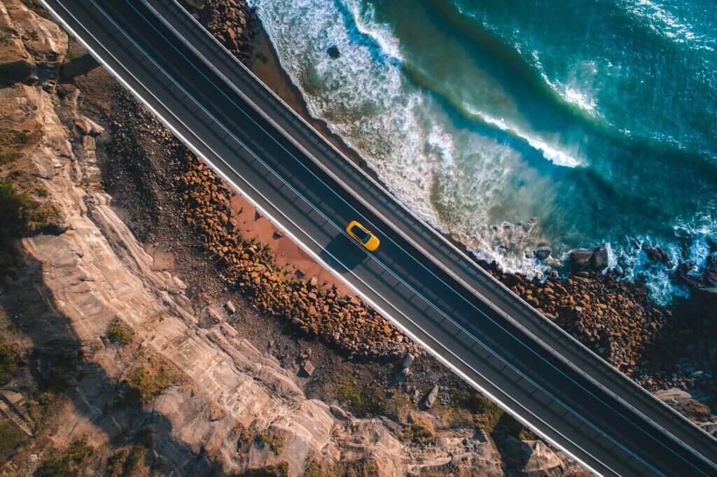 Boundaries between the ocean and the land are created by a road